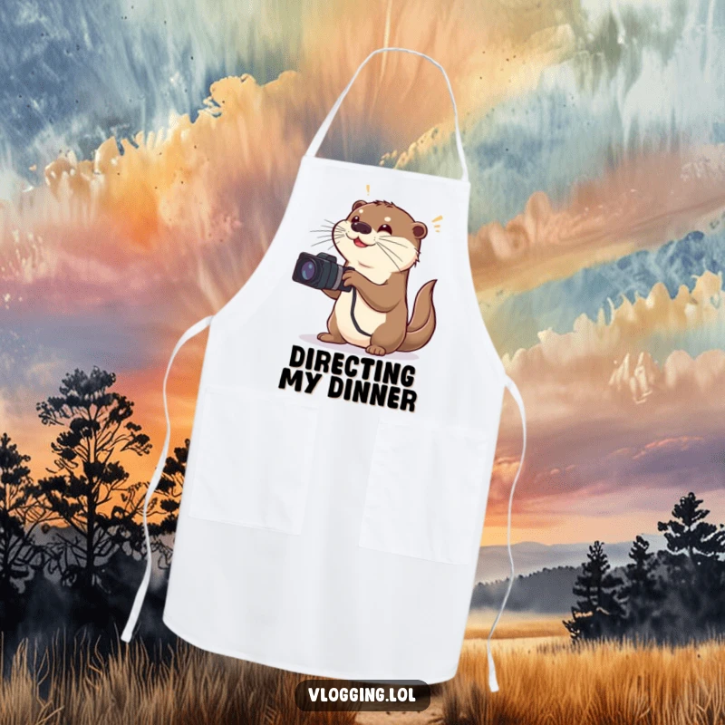 Funny apron with a playful otter acting as a director, making exaggerated gestures while filming what looks like a kitchen scene.
