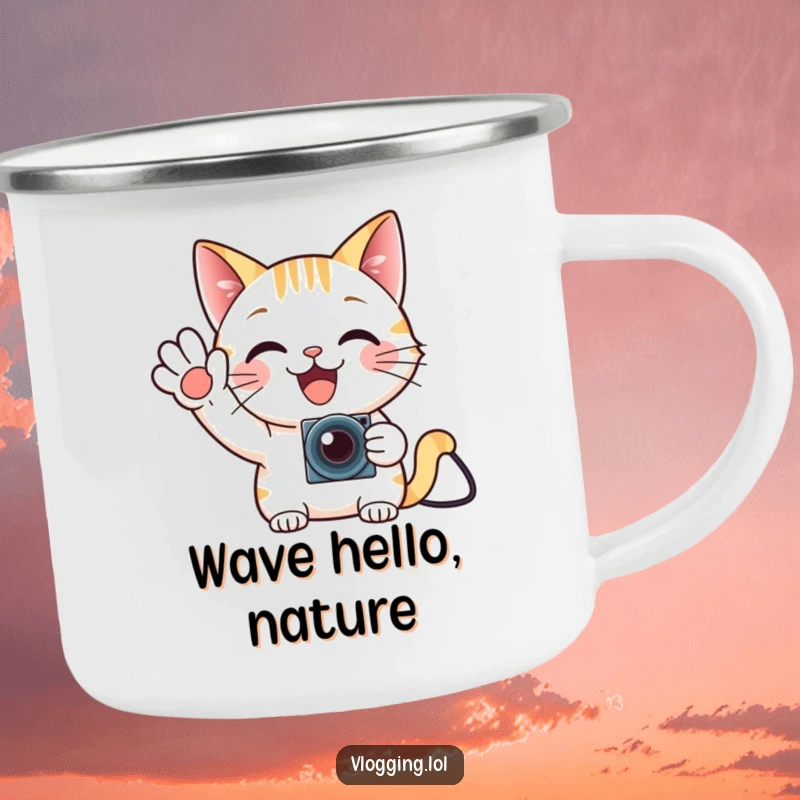 Funny cat gamer camping mug, waving enthusiastically at a tiny camera, for outdoor enjoyment.