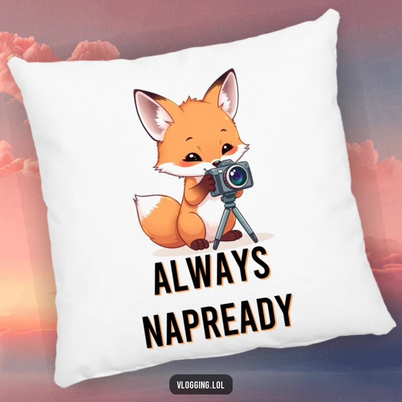Funny pillow depicting a curious fox engrossed in playing with a small camera mounted on a tripod, offering humorous comfort.