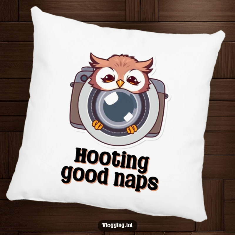 Funny giggling owl pillow, peeking humorously from behind a camera lens, offering comfort and a charmingly amusing photographic accent.