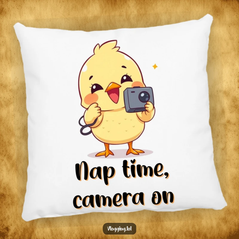 Funny pillow with a happy chick engrossed in recording a video using a miniature camcorder.