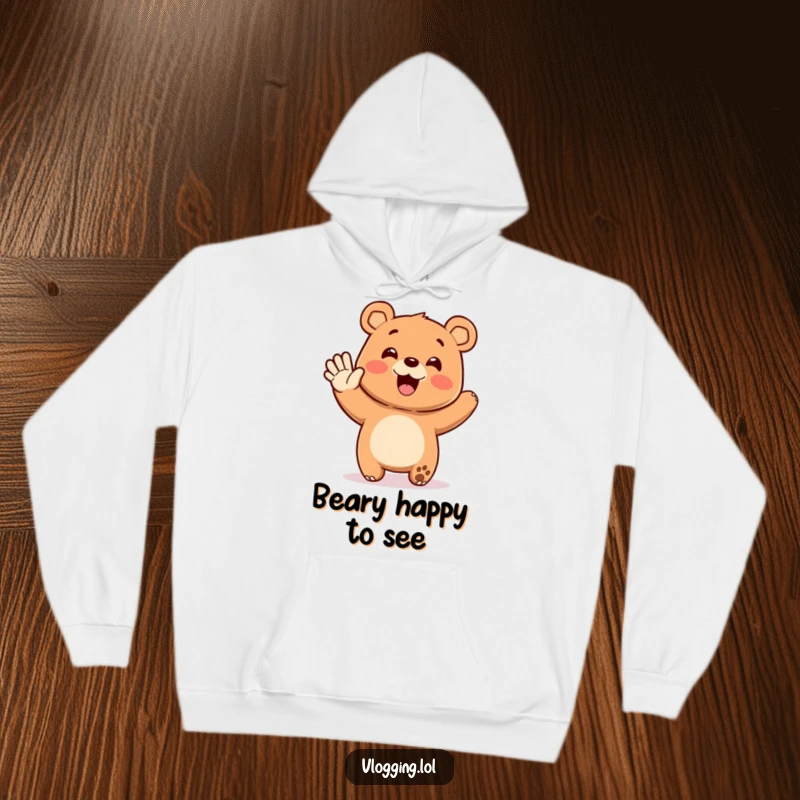 Funny hoodie graphic of a happy bear enthusiastically waving at an unseen audience, offering humorous comfort and a warm, welcoming vibe.
