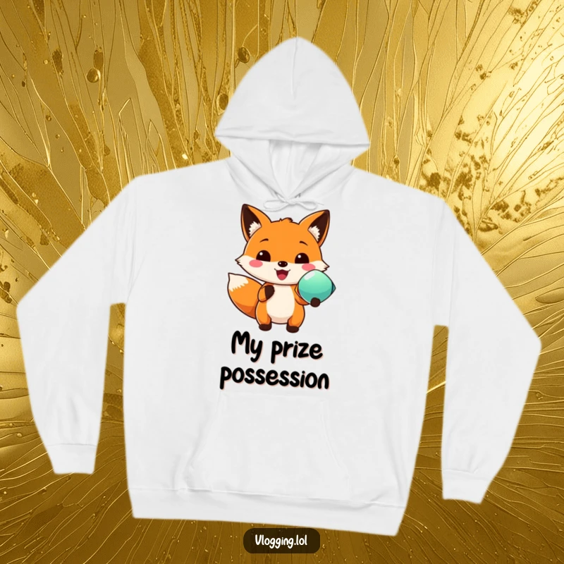Funny hoodie displaying a beaming fox proudly presenting a vividly colored object, exuding joy and a sense of accomplishment.