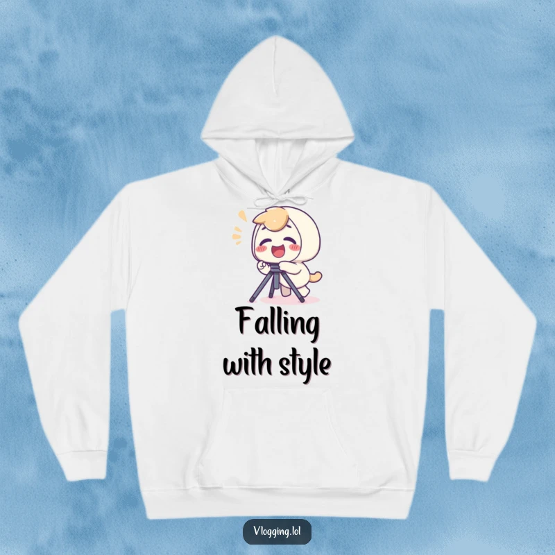 Funny hoodie featuring a giggling character tripping over a camera tripod, a look of playful surprise on their face.
