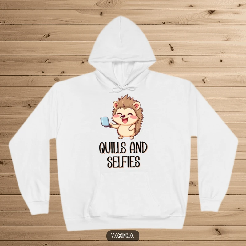 Funny hoodie showcasing a giggling hedgehog smiling widely while holding a selfie stick, perfect for a humorous social media lover's cozy setup.