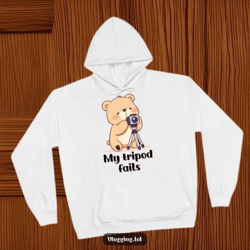 Funny hoodie featuring a silly bear struggling humorously with a camera tripod, perfect for cozy photo sessions.