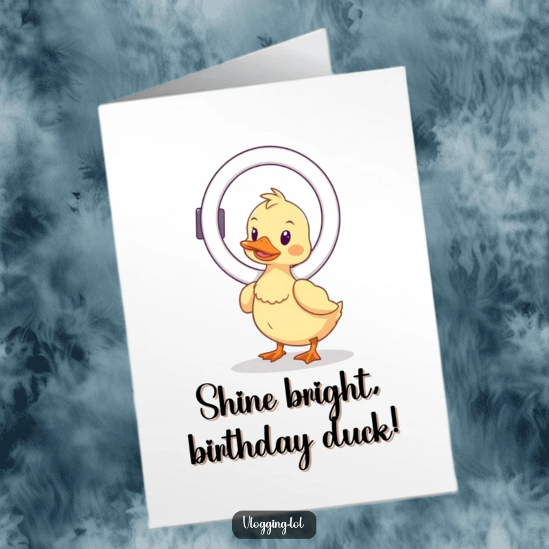 Funny free printable birthday card featuring a wobbly duck hilariously trying to balance a ring light, ready for the spotlight.