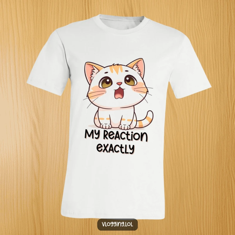 Funny t-shirt design of a cat with exaggeratedly wide eyes and an open mouth, reacting with comical surprise to an off-screen event.