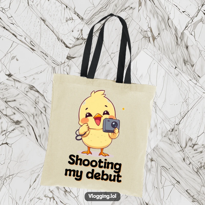 Funny tote bag featuring a delighted chick operating a small camcorder for video recording.